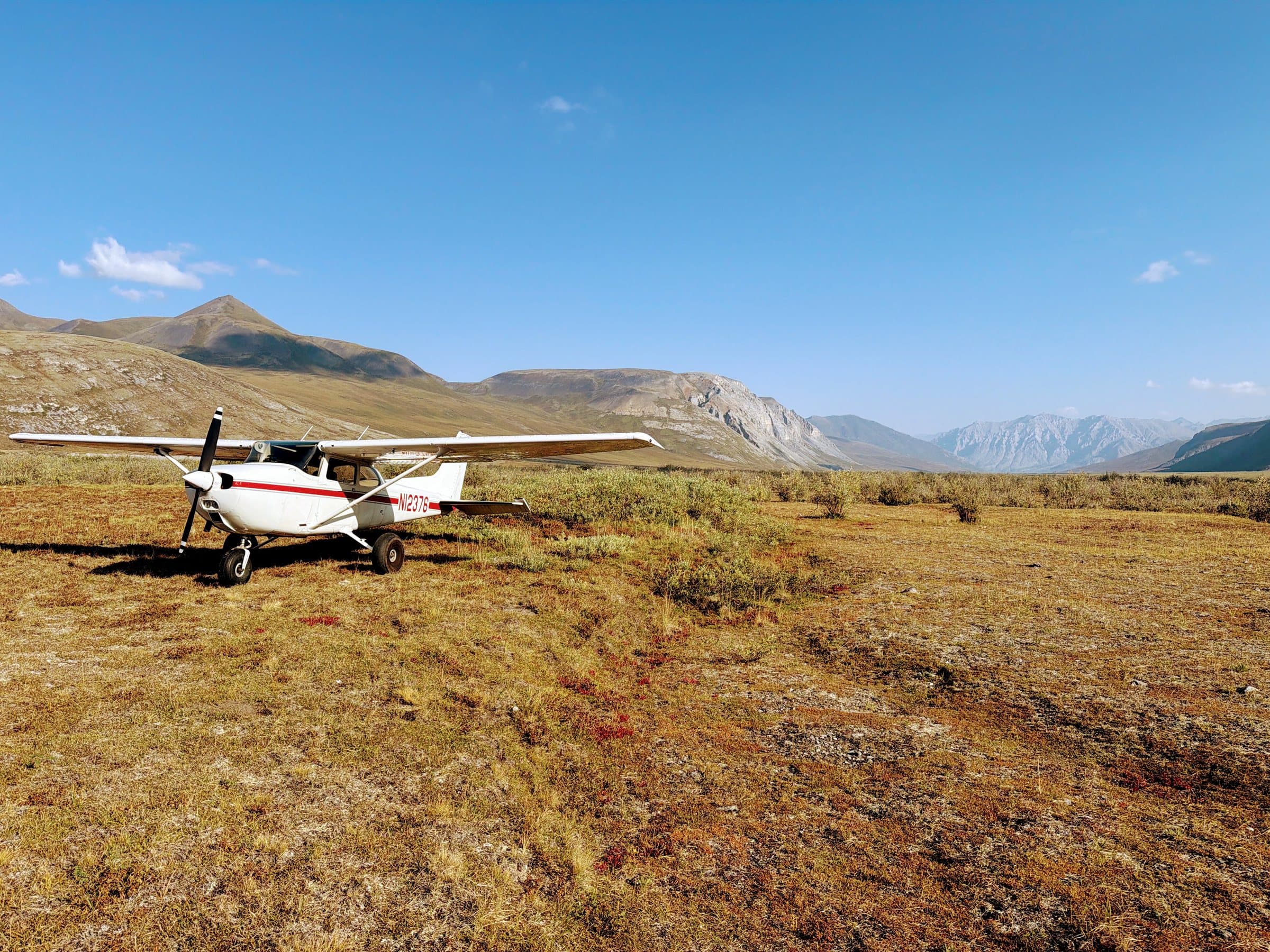 Tundra valley and bush plane.